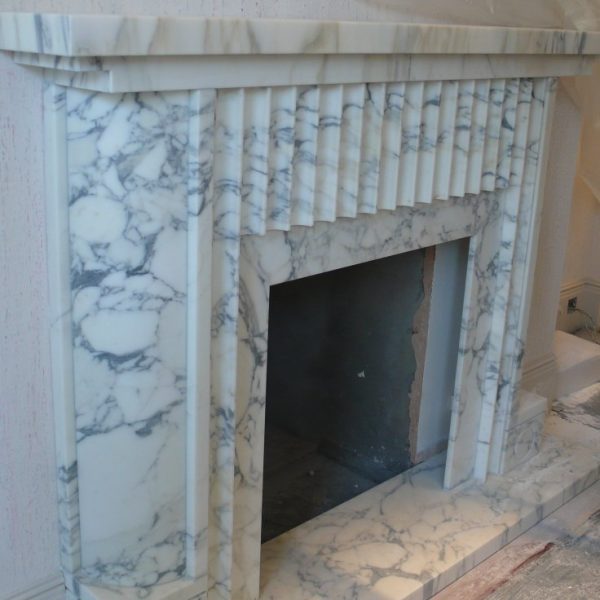 “Arabescato marble fireplace — refined, bright, and unique.”