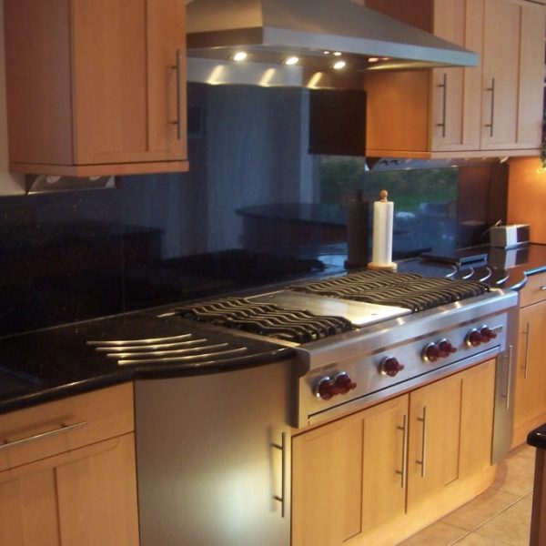 Elegant Black Galaxy granite countertop featuring a glossy black surface with shimmering gold flecks—perfect for modern kitchens