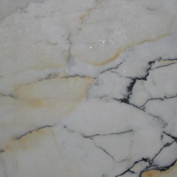 “Elegant Paonazzo marble featuring striking red veins on a pristine white background.”