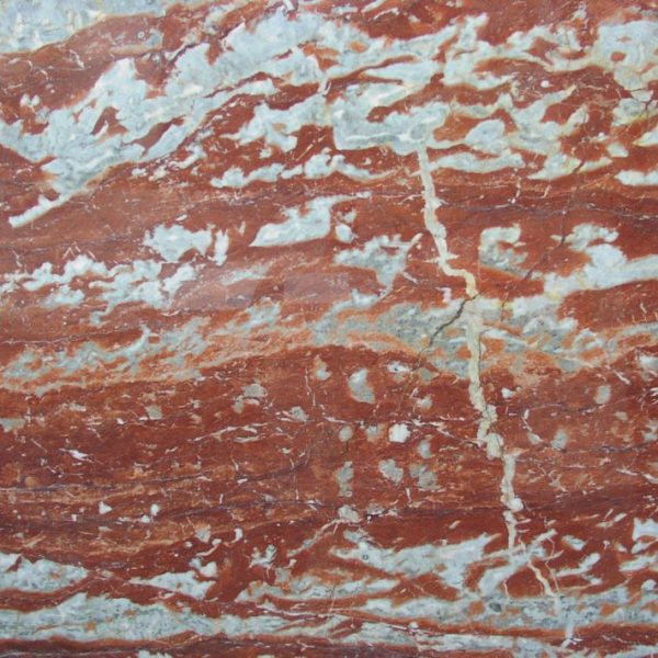 Polished red French marble showcasing its natural patterns and vibrant color.